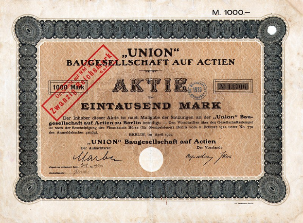 Alte deutsche Banknote mit einem roten Stempel und Text, wahrscheinlich ein Aktienzertifikat.